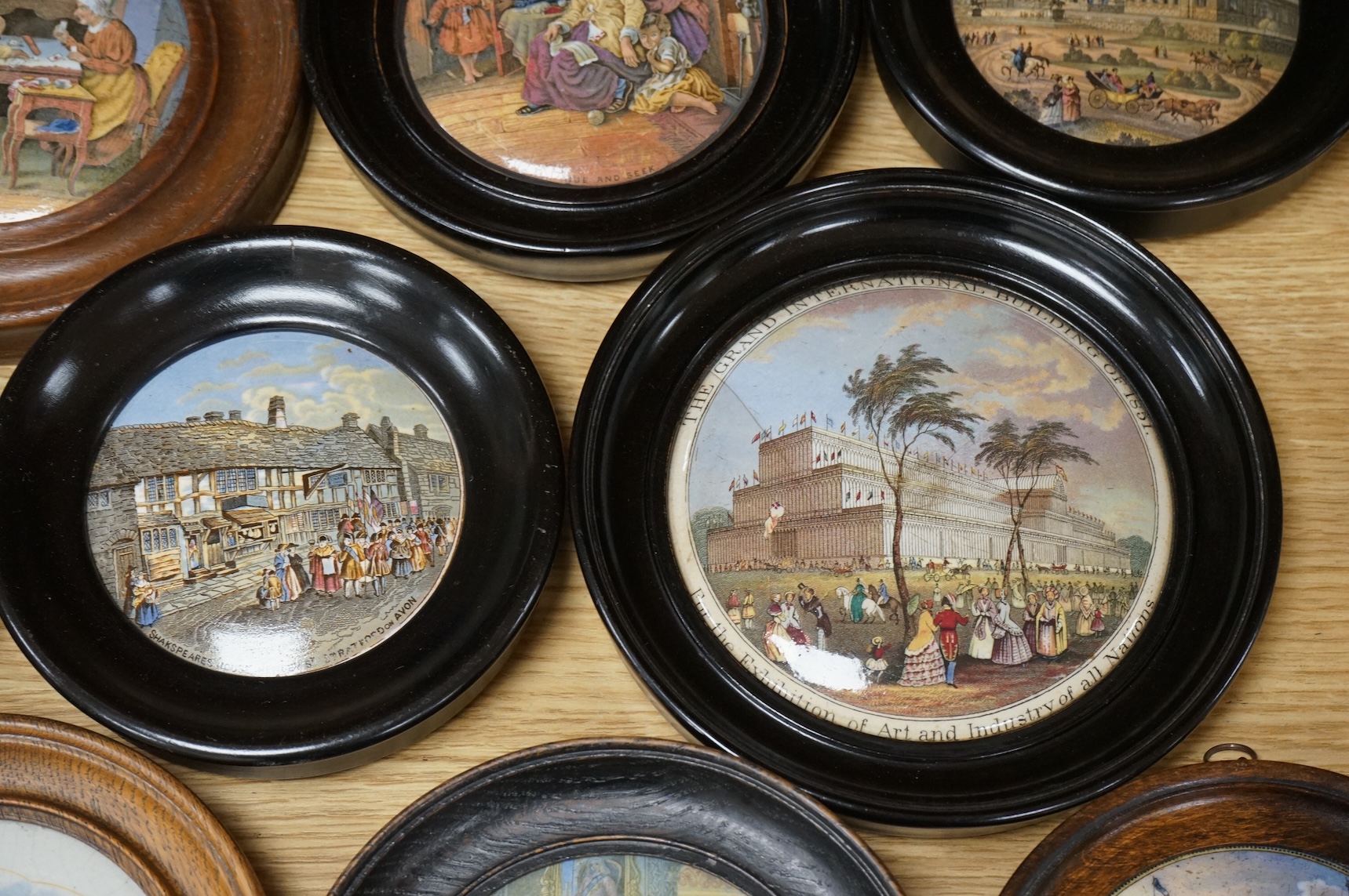 A collection of eleven framed pot lids, including one of the Chrystal Palace; The Grand International Building of 1851, For The Exhibition of Art and Industry of all Nations, Crystal Palace pot lid 12.5cm diameter not in